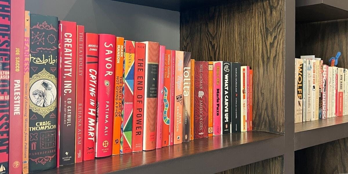 image of a section of a library with red books
